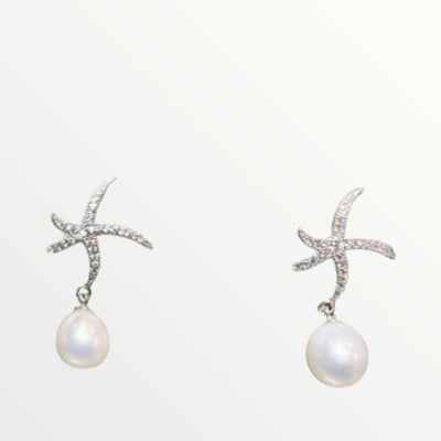 Boucles d'oreille étoile en argent porté par lara fabian perla création.