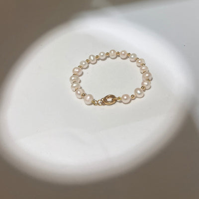Collier en perles d’eau et Or